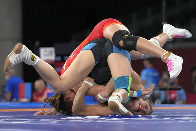In this August 2, 2021, file photo, Germany's Anna Carmen Schell, right, compete against Egypt's Enas Ahmed during their women's 68kg freestyle wrestling match at the 2020 Summer Olympics in Chiba, Japan.  (Photo by Aaron Favila/AP Photo/File)