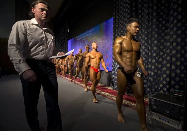 Participants take part in Belarus bodybuilding and fitness championship in Minsk April 25, 2015. (Photo by Vasily Fedosenko/Reuters)