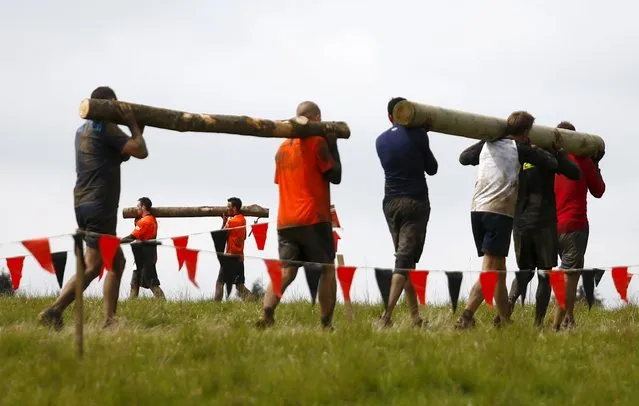 Competitors participate in the Tough Mudder challenge near Henley-on-Thames in southern England May 2, 2015. (Photo by Eddie Keogh/Reuters)