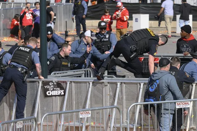 Law enforcement personnel clear the area around Union Station following a shooting at the Kansas City Chiefs NFL football Super Bowl celebration in Kansas City, Mo., Wednesday, February 14, 2024. Multiple people were injured, a fire official said.. (Photo by Reed Hoffmann/AP Photo)