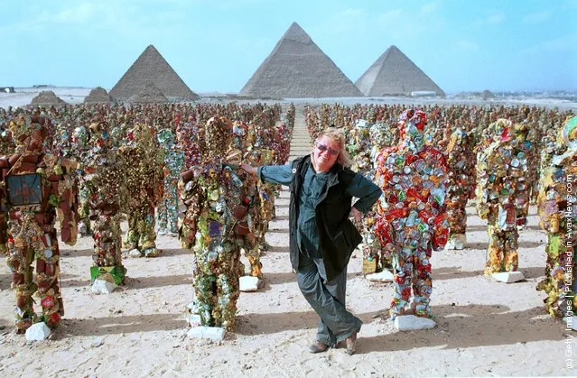 German artist Ha Schult stands with his trash people below the pyramids May 15, 2002 in Giza, Egypt