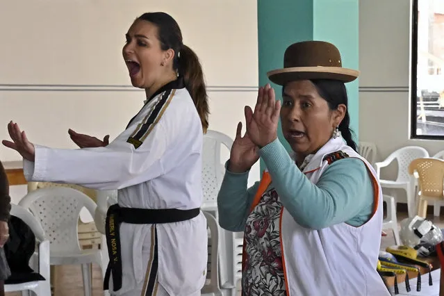 Taekwondo instructors Kimberly Nosa (L) and Aymara Indigenous Lidia Mayta conduct the personal self-defense and therapy workshop called Warmi Power to prevent sexist violence in El Alto, Bolivia, on February 21, 2024. A violent attack by would-be robbers steered Bolivian Lidia Mayta towards the martial art of taekwondo. Three years later, she helps train other Indigenous women to defend themselves against rampant gender-based violence in the South American country. (Photo by Aizar Raldes/AFP Photo)