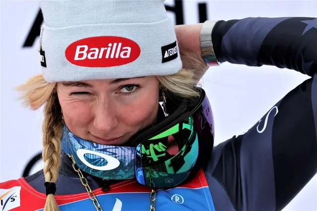 United States' Mikaela Shiffrin adjusts her hat on the podium after winning an alpine ski, women's World Cup giant slalom, in Kronplatz, Italy, Tuesday, January 24, 2023. Shiffrin won a record 83rd World Cup race Tuesday. (Photo by Alessandro Trovati/AP Photo)