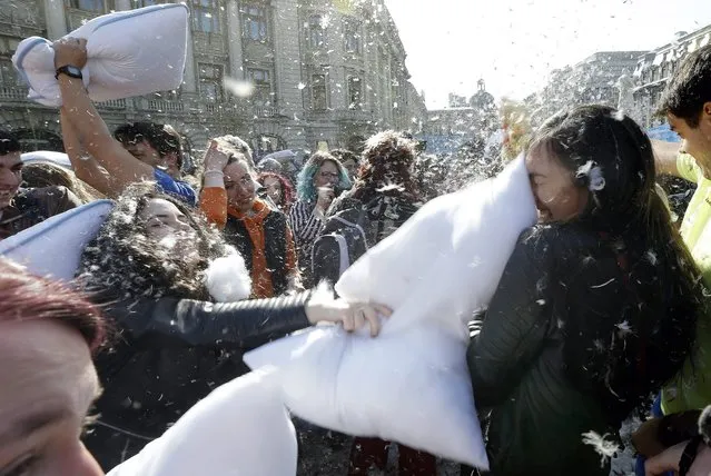 Romanian young people fight with pillows during the International Pillow Fight Day in Bucharest, Romania, 02 April 2016. (Photo by Robert Ghement/EPA)