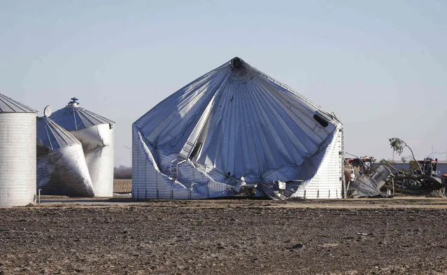 Damage to a grain bin is seen in Greene County, Iowa, on Thursday, December 16, 2021, after a band of severe weather produced strong wind gusts and reports of tornadoes across much of the state Wednesday night. The storm caused property damage and downed power lines, leaving many Iowans without electricity. (Photo by Bryon Houlgrave/The Des Moines Register via AP Photo)