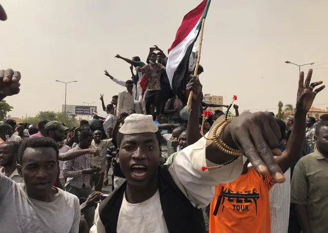 Sudanese protesters shout slogans as they march during a demonstration against the military council, in Khartoum, Sudan, Sunday, June 30, 2019. Tens of thousands of protesters have taken to the streets in Sudan's capital and elsewhere in the country calling for civilian rule nearly three months after the army forced out long-ruling autocrat Omar al-Bashir. The demonstrations came amid a weekslong standoff between the ruling military council and protest leaders. (Photo by Hussein Malla/AP Photo)