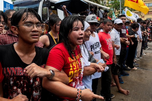 Filipino activists join a Labor Day protest near the U.S. Embassy in Manila, Philippines on May 1, 2024. (Photo by Lisa Marie David/Reuters)