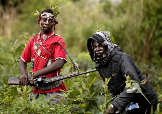 Members of the anti-balaka, a Christian militia, patrol outside the village of Zawa April 8, 2014. (Photo by Goran Tomasevic/Reuters)