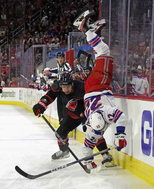 Dmitry Orlov #7 of the Carolina Hurricanes hits Jonny Brodzinski #22 of the New York Rangers during the third period in Game Four of the Second Round of the 2024 Stanley Cup Playoffs at PNC Arena on May 11, 2024 in Raleigh, North Carolina. (Photo by Bruce Bennett/Getty Images)