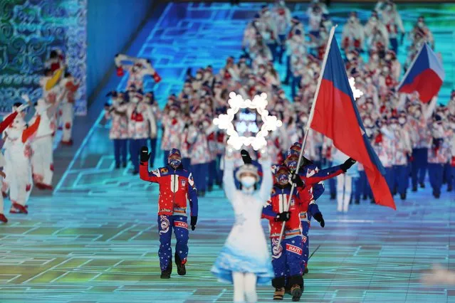 Haiti's flag bearer Richardson Viano leads the delegation as they enter the stadium during the opening ceremony of the Beijing 2022 Winter Olympic Games, at the National Stadium, known as the Bird's Nest, in Beijing, on February 4, 2022. (Photo by Marko Djurica/Reuters)