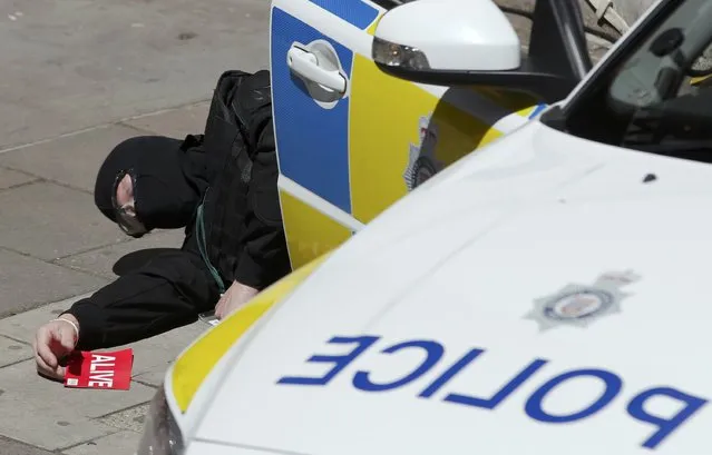 London Metropolitan Police take part in Exercise Strong Tower, the scene of a mock terror attack at a disused underground station in central London, Britain June 30, 2015. (Photo by Peter Nicholls/Reuters)