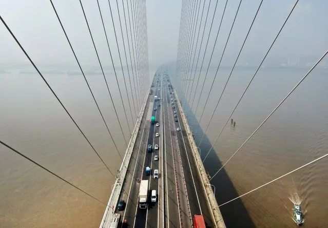 This aerial photo taken on August 14, 2019 shows a view of the Sutong Bridge in Nantong in China's eastern Jiangsu province. (Photo by AFP Photo/China Stringer Network)
