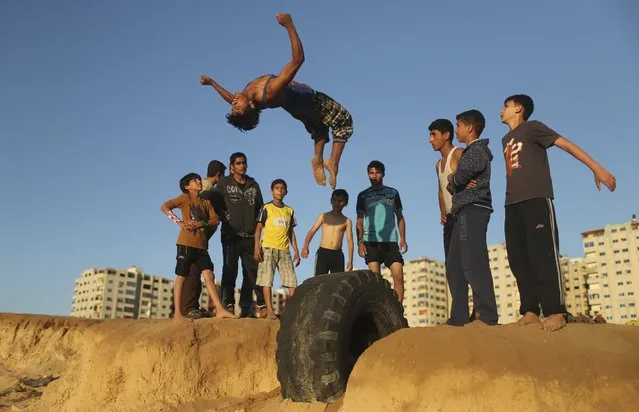 A Palestinian youth practices his parkour skills at Shati refugee camp in Gaza City April 27, 2014. (Photo by Mohammed Salem/Reuters)