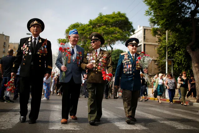 World War Two veterans take part in a march marking Victory Day, the anniversary of the victory of the Allies over Nazi Germany, in Ashdod, Israel, May 9, 2016. (Photo by Amir Cohen/Reuters)