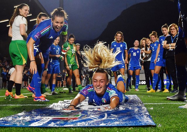Italy's Giada Greggi, Elena Linari and teammates celebrate after qualifying for the Women's Euro 2025, in Bolzano, Italy on July 16, 2024. (Photo by Jennifer Lorenzini/Reuters)