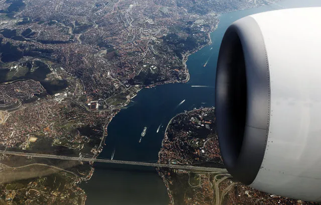 Bosphorus strait and the Fatih Sultan Mehmet bridge are pictured through the window of a passenger aircraft over Istanbul, Turkey, Turkey, March 24, 2017. (Photo by Murad Sezer/Reuters)