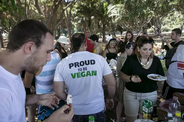 People attend a vegan picnic at Hayarkon Park in Tel Aviv, Israel July 18, 2015. (Photo by Baz Ratner/Reuters)