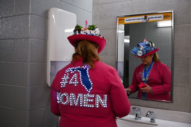 An attendee stands in the restroom during Day 1 of the Democratic National Convention (DNC) at the United Center, in Chicago, Illinois, U.S., August 19, 2024. (Photo by Callaghan O'hare/Reuters)