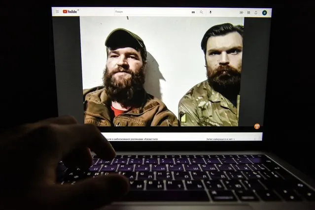 A video of a press conference from the Azovstal steel plant in Mariupol by Azov regiment servicemen Illia Samoilenko (R) and Sviatoslav Palamar (L) is seen on a computer screen in Kyiv, Ukraine, 08 May 2022. On 24 February, Russian troops had entered Ukrainian territory in what the Russian president declared a “special military operation”, resulting in fighting and destruction in the country, a huge flow of refugees, and multiple sanctions against Russia. (Photo by Oleg Petrasyuk/EPA/EFE)