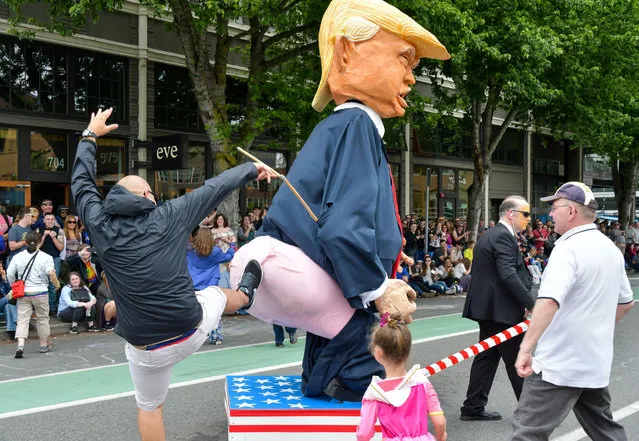 Fremont Arts Council's yearly parade draws big crowds providing unique photos and craziness in Washington DC, USA on June 17, 2017. Highlighting todays parade were the naked cyclists and Anti-Trump floats. (Photo by Veda Jo Jenkins/Rex Features/Shutterstock)