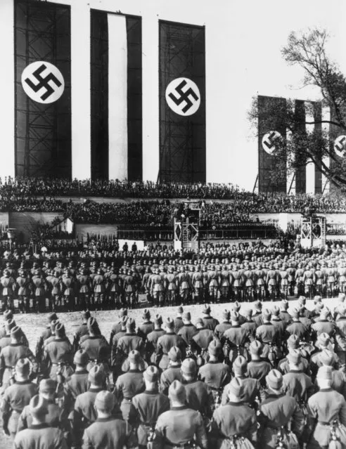 1st May 1934:  Massed ranks of German soldiers at the Tempelhof airfield to listen to a May Day speech by Hitler as Chancellor