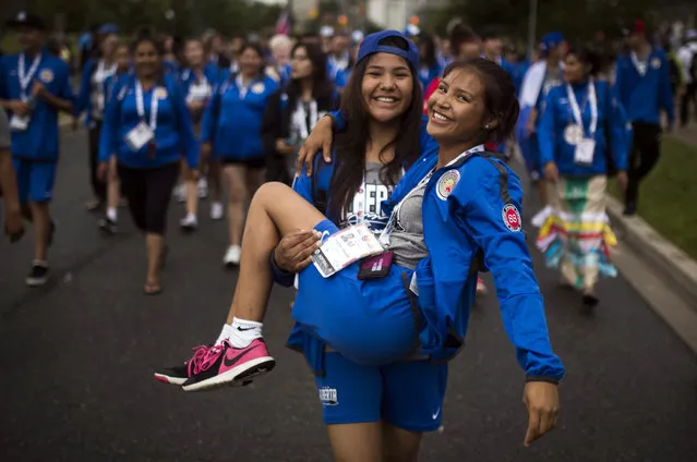 Athletes from Team Alberta arrive ahead of the opening ceremony for the North American Indigenous Games in Toronto, Sunday, July 16, 2017. (Photo by Mark Blinch/The Canadian Press via AP Photo)