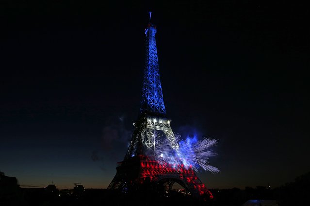The Eiffel Tower is illuminated during the traditional Bastille Day fireworks display in Paris July 14, 2014. (Photo by Benoit Tessier/Reuters)