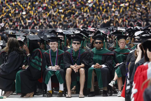 A student in flip flops and shorts receives an honorary degree during the spring commencement ceremony at Ohio State University in Columbus, May 5, 2013. (Photo by Jason Reed/Reuters)