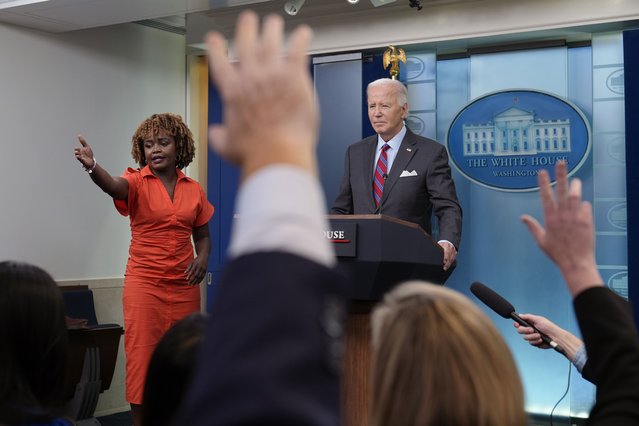 President Joe Biden, standing with White House press secretary Karine Jean-Pierre, speaks during a surprise appearance to take questions during the daily briefing at the White House in Washington, Friday, October 4, 2024. (Photo by Susan Walsh/AP Photo)