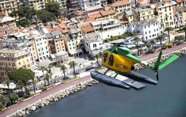 An aerial view shows a Guardia di Finanza (GdF, Economic and Financial Police) helicopter during a patrolling flight of the Ligurian Riviera, in Genoa, northern Italy, 18 April 2020, during a nationwide lockdown over the coronavirus disease (COVID-19) pandemic. Countries around the world are taking increased measures to stem the widespread of the SARS-CoV-2 coronavirus which causes the COVID-19 disease. (Photo by Luca Zennaro/EPA/EFE/Rex Features/Shutterstock)
