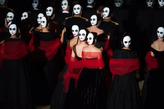 Actors and singers perform during the opera “La Traviata” by Giuseppe Verdi, directed by Louis Desire and conducted by Daniele Rustioni, on July 31, 2016 in Orange, southern France, during the Choregies d'Orange festival, dedicated to opera, lyrical art and symphonic concert. (Photo by Bertrand Langlois/AFP Photo)