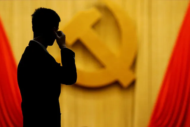 A security agent takes position at the Great Hall of the People during the opening session of the 19th National Congress of the Communist Party of China in Beijing, China October 18, 2017. (Photo by Thomas Peter/Reuters)