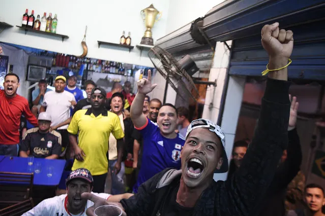 Cesinha Cria cheers after Germany's lone missed penalty kick attempt as he watches the action with fellow fans in Bar do Maia during the men's gold medal soccer match between Brazil and Germany during Rio 2016 on Saturday, August 20, 2016. (Photo by Aaron Ontiveroz/The Denver Post)