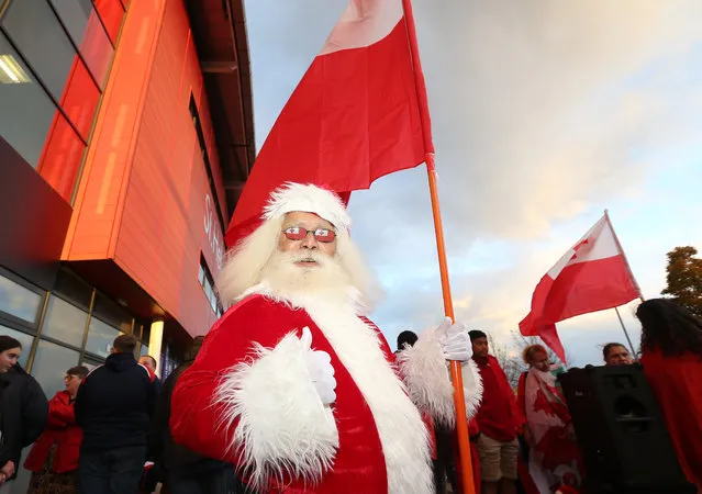 A Tonga Fan dressed as Santa Claus looks on ahead of the Rugby League World Cup 2021 Pool D match between Tonga and Wales at Totally Wicked Stadium on October 24, 2022 in St Helens, England. (Photo by Jan Kruger/Getty Images for RLWC)