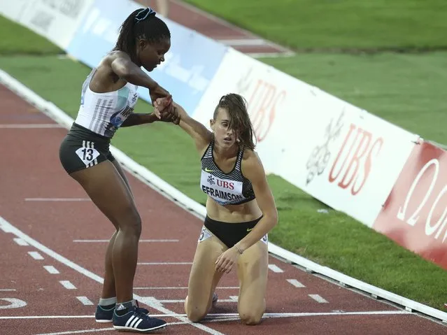 Athletics, IAAF Athletics Diamond League meeting Lausanne, Stade Olympique de la Pontaise, Lausanne, Switzerland on August 25, 2016. Lydia Wafula of Kenia (L) helps Alexa Efraimson of the U.S. following the women's 3,000m competition. (Photo by Ruben Sprich/Reuters)