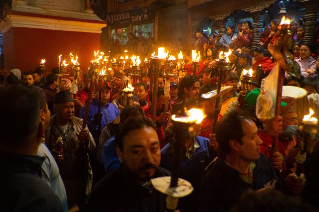 Devotees carrying flaming torches fill the streets during the vibrant celebration of Chanesiya Jatra (Sindoor Jatra), a highlight of the nine-day-long Biska Jatra festival in Bhaktapur, Nepal on April 14, 2025. This annual event marks the Nepali New Year and is observed with traditional processions, music, and cultural rituals. The fiery spectacle not only honors local deities but also symbolizes the community's collective spirit and the ushering in of a new beginning. (Photo by Sujal Bajracharya/ZUMA Press Wire/Rex Features/Shutterstock)
