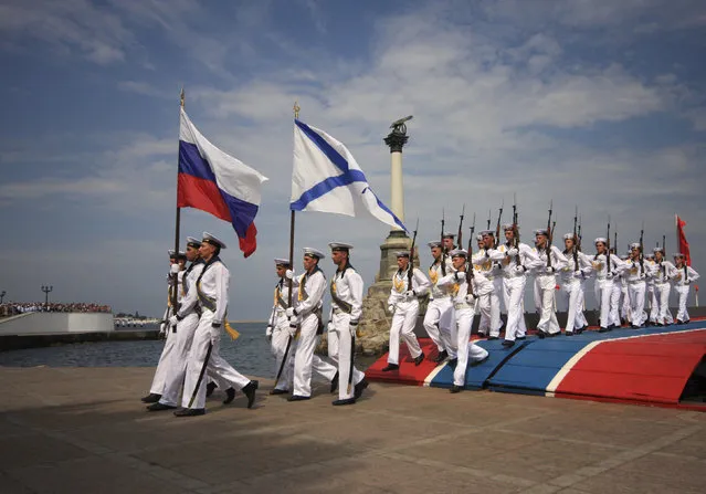Russian sailors march during a naval parade rehearsal in the Crimean port of Sevastopol, July 25, 2014. (Photo by Reuters/Stringer)