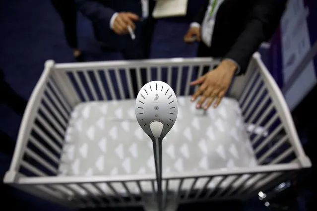 The Cocoon Cam baby vital signs monitor stands above a crib during the CES Unveiled event at the 2018 Consumer Electronics Show (CES) in Las Vegas, Nevada, U.S., on Sunday, January 7, 2018. (Photo by Patrick T. Fallon/Bloomberg News)