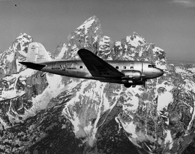 Winging Its Way Past The Peaks Of The Rockies. An air liner from union air terminal passing the towering peaks of the grand Tetons in Wyoming. On the inaugural flight of the new direct service of western air express from los Angeles to yellows tone national park. August 07, 1940. (Photo by New York Post/Photo Archives, LLC via Getty Images)