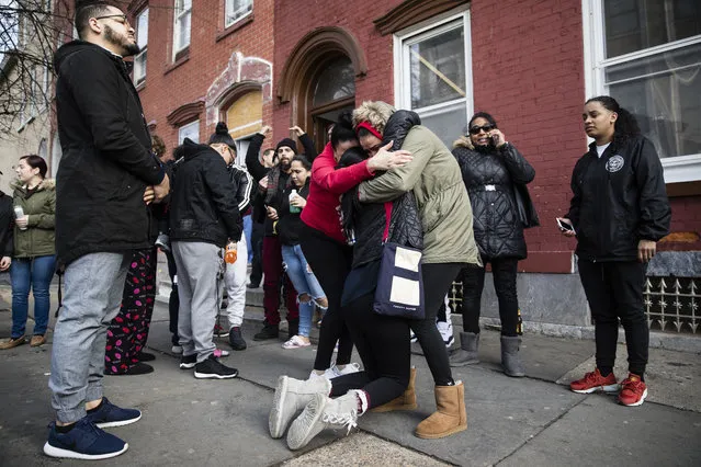 Mourners gather Monday, January 29, 2018, where authorities say at least four people have been shot to death the day before, in Reading, Pa. (Photo by Matt Rourke/AP Photo)