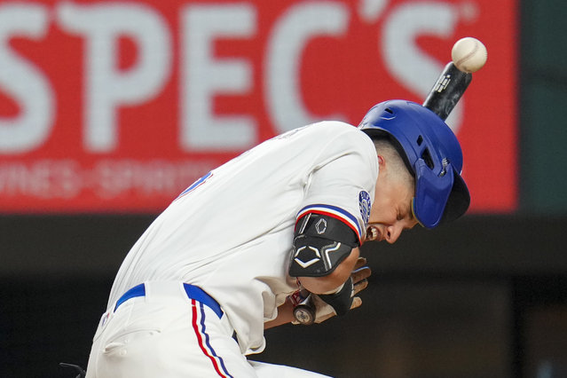 Texas Rangers' Corey Seager is hit by a pitch from Baltimore Orioles pitcher Gregory Soto during the eighth inning of a baseball game Tuesday, July 1, 2025, in Arlington, Texas. (Photo by Julio Cortez/AP Photo)