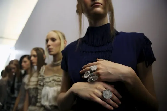 Models line up backstage before the PatBo Winter 2016 RTW collection during Sao Paulo Fashion Week October 20, 2015. (Photo by Nacho Doce/Reuters)