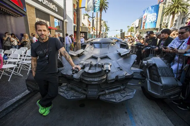 Director Zack Snyder poses by a Batmobile used in the movie "Batman v Superman: Dawn of Justice" before posthumously unveiling the star of Batman creator Bob Kane on the Hollywood Walk of Fame in Los Angeles, California October 21, 2015. (Photo by Mario Anzuoni/Reuters)