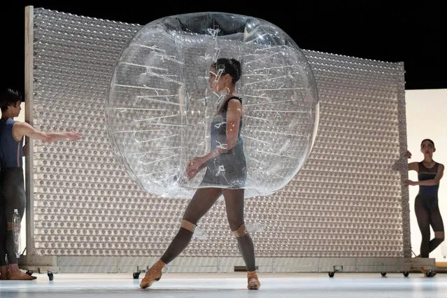 This photo taken on January 7, 2023 shows performers taking part in the dress rehearsal for the “PET Bottle Labyrinth”, one half of an innovative two-part performance by the K-BALLET dance company entitled “Plastic” to highlight the issue of plastic pollution, at the Kanagawa Arts Theatre in Yokohama, south of Tokyo. (Photo by Richard A. Brooks/AFP Photo)