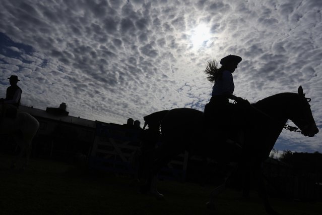 Amalia Rodríguez rides a horse at a rodeo celebrating Independence Day in San Isidro, Argentina, Wednesday, July 9, 2025. (Photo by Natacha Pisarenko/AP Photo)