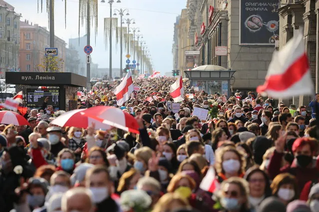 People attend an opposition rally to reject the Belarusian presidential election results in Minsk, Belarus on October 26, 2020. (Photo by Reuters/Stringer)