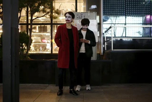 Men wearing Halloween face paint participate in Halloween celebrations in the downtown of Seoul, South Korea, October 31, 2015. (Photo by Kim Hong-Ji/Reuters)