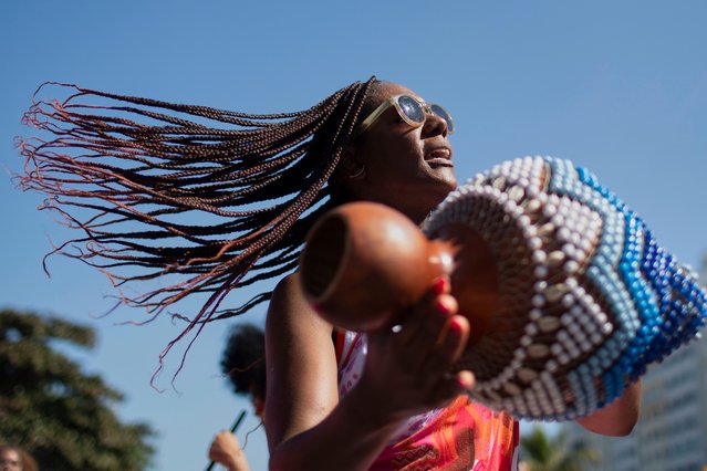 A musician performs during the Black Women's March against racial and gender discrimination at Copacabana Beach in Rio de Janeiro, Brazil, July 27, 2025. (Photo by Bruna Prado/AP Photo)