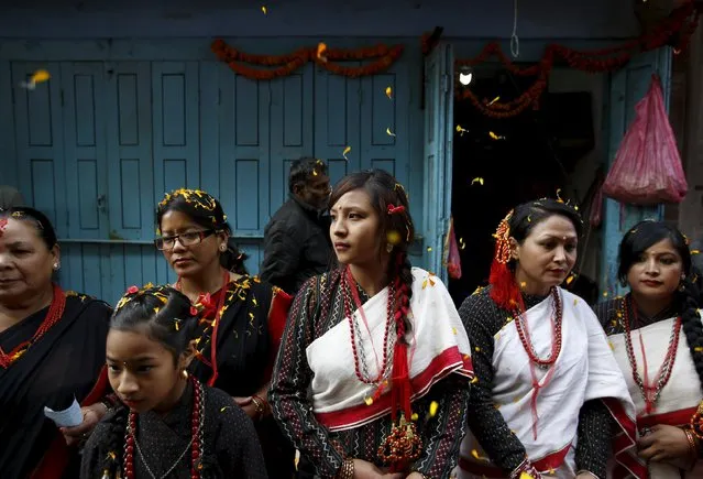 Participants from Newar community in traditional attire, takes part in the parade to celebrate Newari New Year that falls during the Tihar festival, also called Diwali, in Kathmandu, Nepal November 12, 2015. (Photo by Navesh Chitrakar/Reuters)