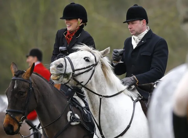 Members of the Quorn Hunt take a drink before the traditional Boxing Day meet at Prestwold Hall near Loughborough December 26, 2014. (Photo by Darren Staples/Reuters)